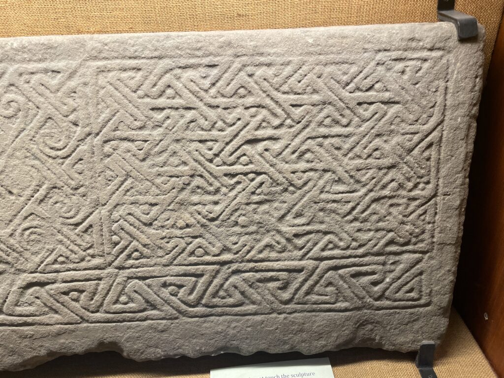 An image of a carved stone with Celtic/pictish key pattern