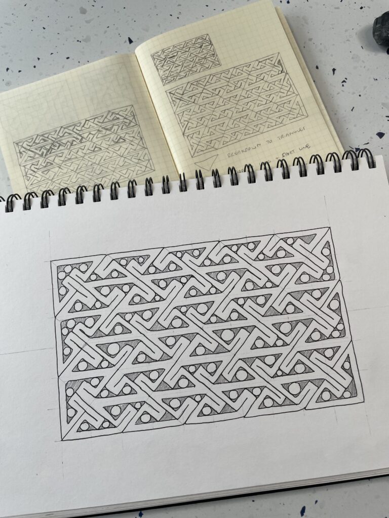 sketchbook page with key patterns in pen